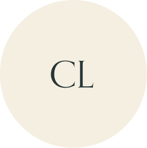 Cream circular monogram with CL initials.