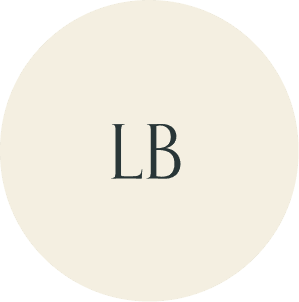 Cream circular monogram with LB initials.