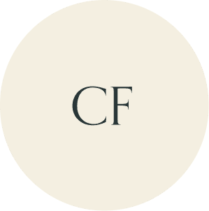 Cream circular monogram with CF initials.