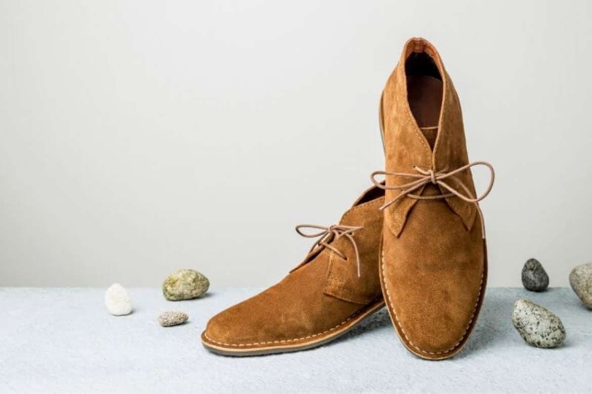 Dress shoes displayed with menswear accessories.
