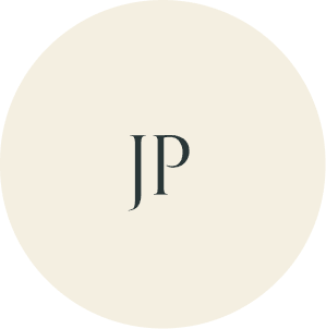 Cream circular monogram with JP initials.