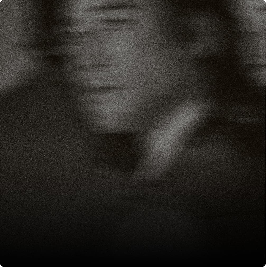 Grainy black-and-white abstract portrait image.
