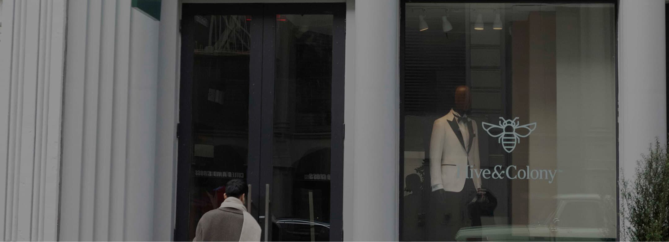Hive & Colony Soho storefront with white tuxedo display.
