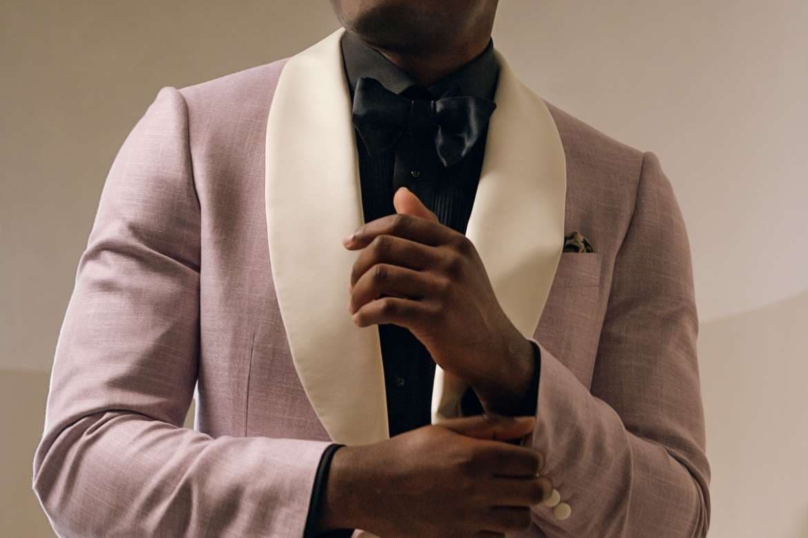 Groom wearing a tailored wedding suit.